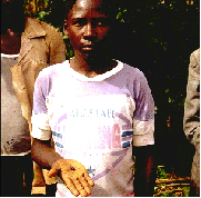 The locky boy of Mbale, with the L6 condrite fragment that landed on his head.