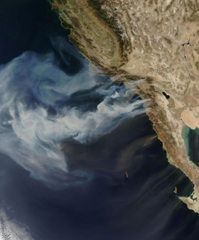 Smoke plumes from southern California wildfires billowing out over the Pacific Ocean