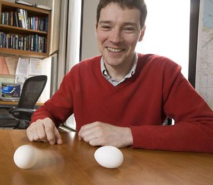Jean-Luc Margot, assistant professor of astronomy at Cornell University, uses a raw egg (right, still) and a cooked egg (left, spinning) to illustrate how an object's spin state can reveal information about its interior.