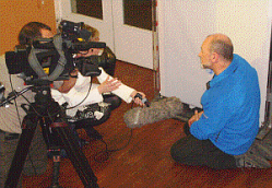 Roger being filmed in front of the seismogram of the earthquake in the Earth Sciences building. Photo: Gary Keech