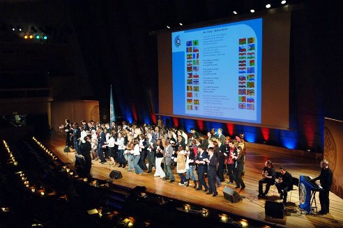 Students from all over the world join in singing the 