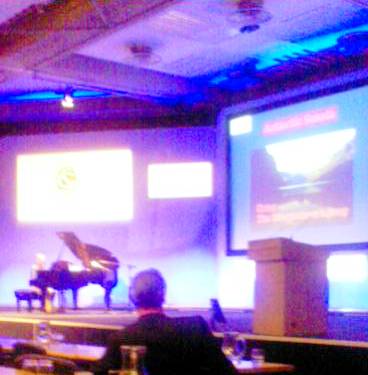 Kevin Jones plays the Sonata while Nick Petford (foreground) listens and the associated graphics play over the screen