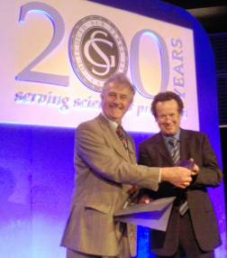 Dr Fortey (left) receives the von Buch Medal from Dr Rolling