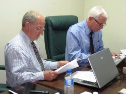 Gaskarth (left) and John Powell pore over course provision details
