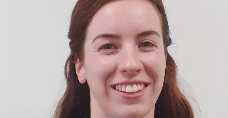 head shot of white female with long brown hair