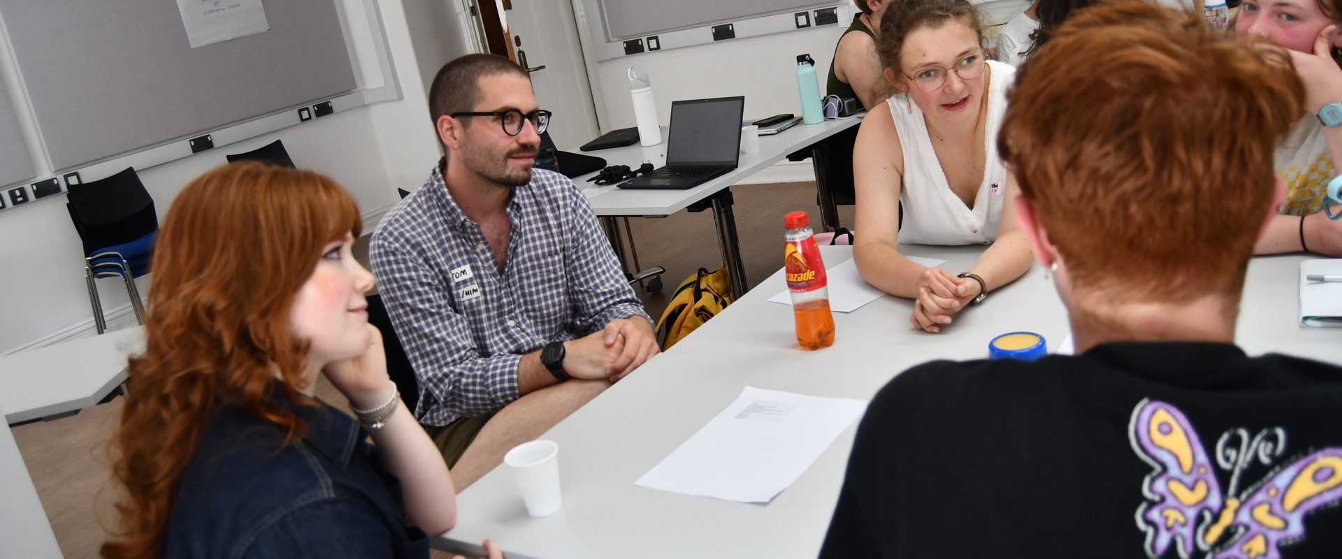 Students talking to each other on a classroom