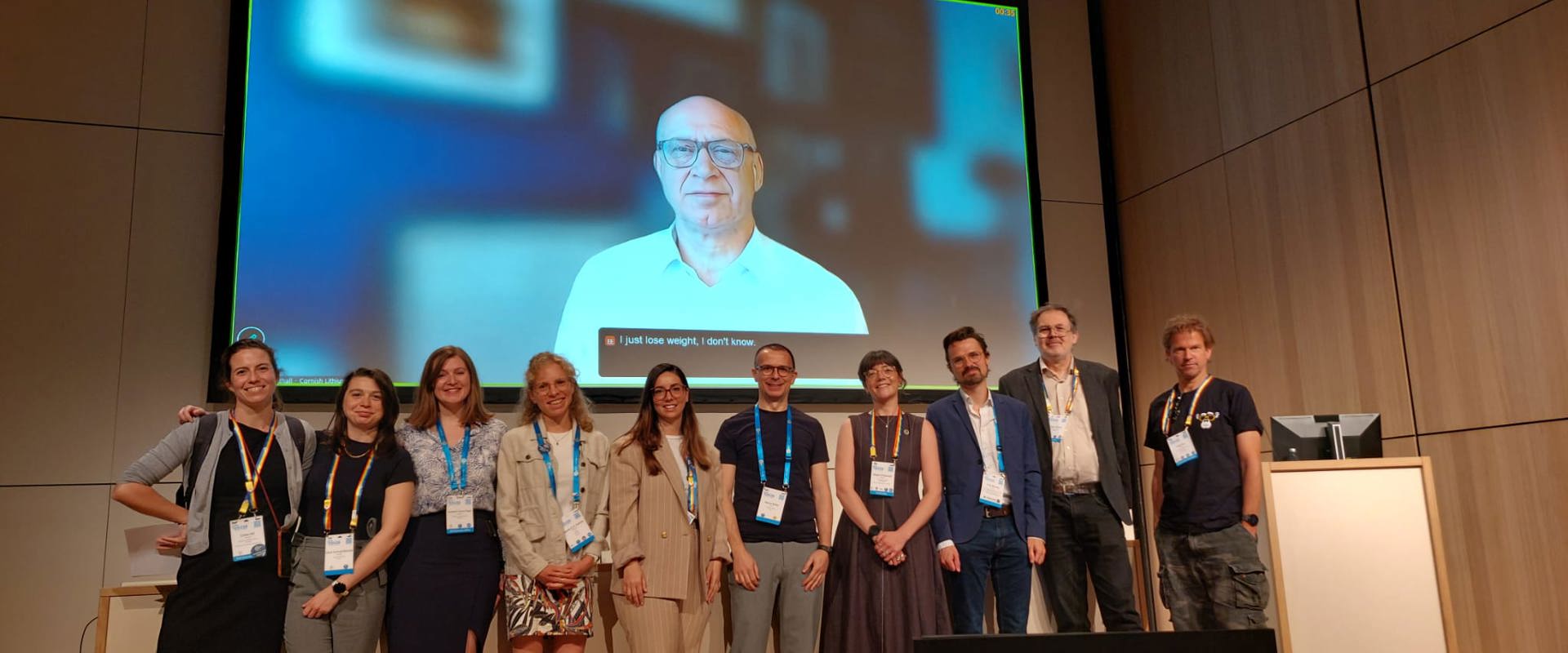 Panellists posing for a photo on the stage after an EGU session