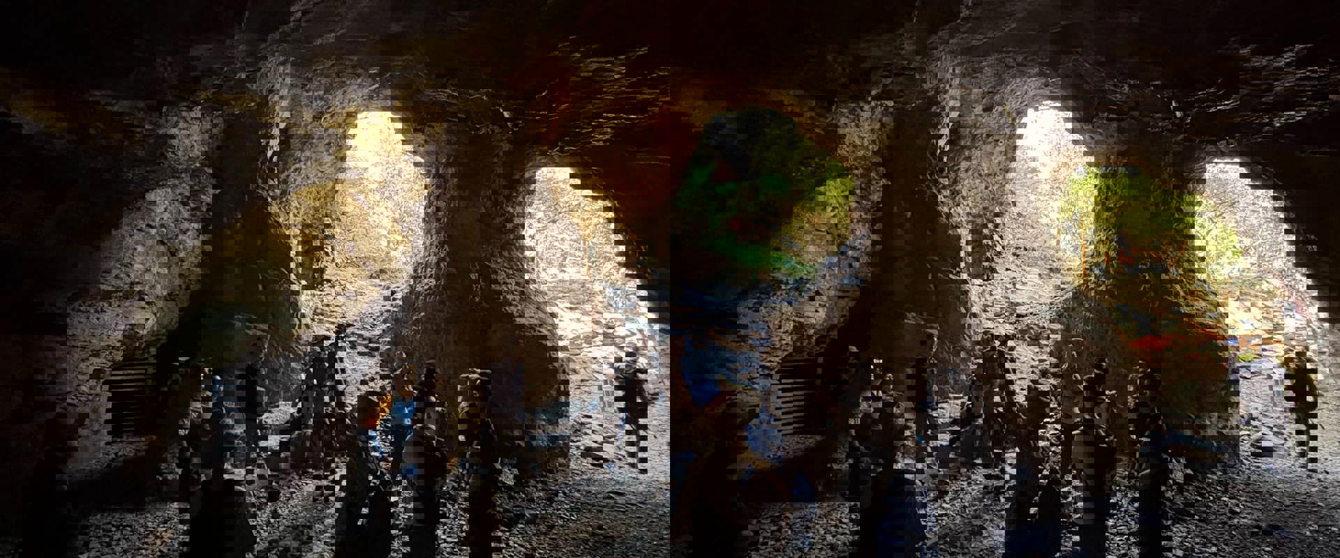 a group of people standing inside a mine