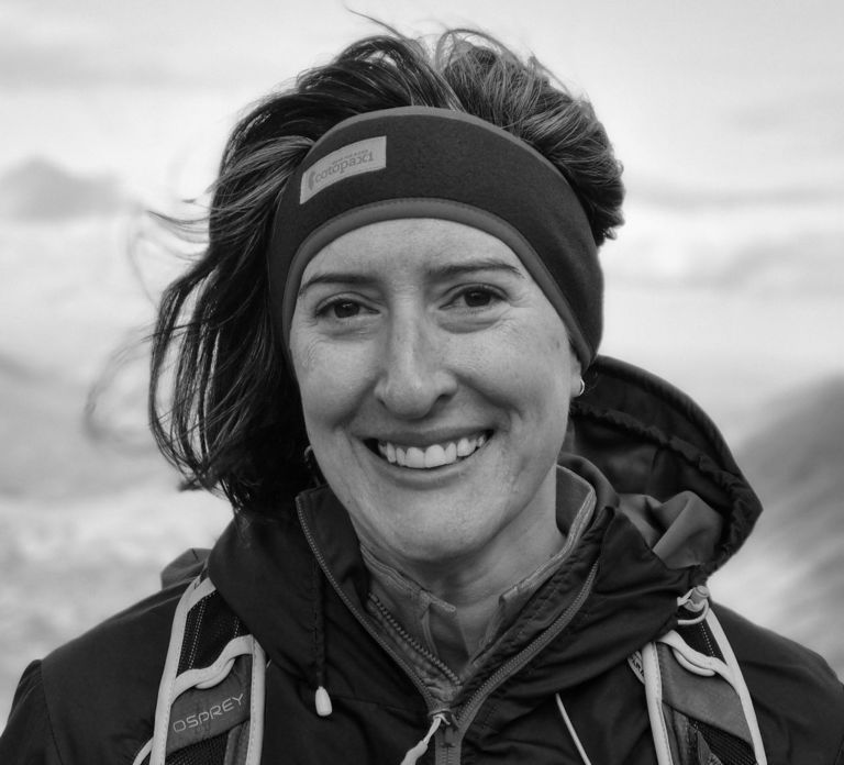 woman wearing a waterproof coat and bandana