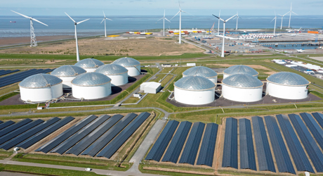 Aerial from industry in the Eemshaven Delftzijl in the Netherlands with wind turbines