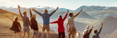 Friends on a mountaintop cheering