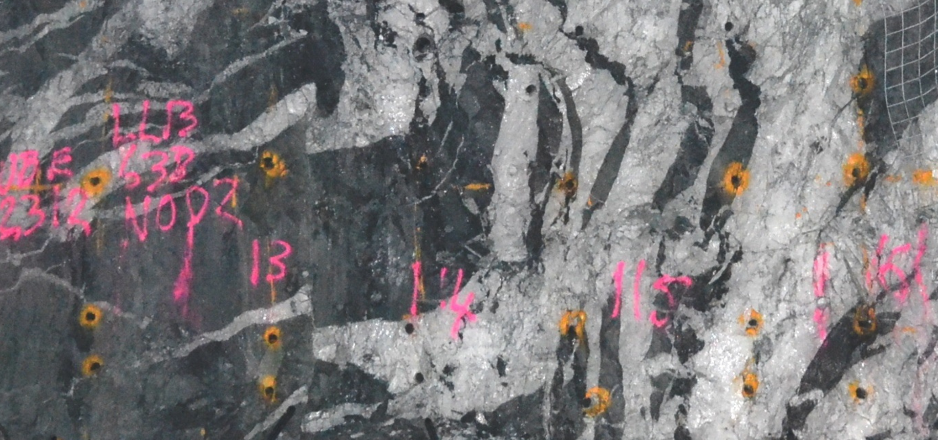 black and grey swirling background with pink numbers and letters written on it
