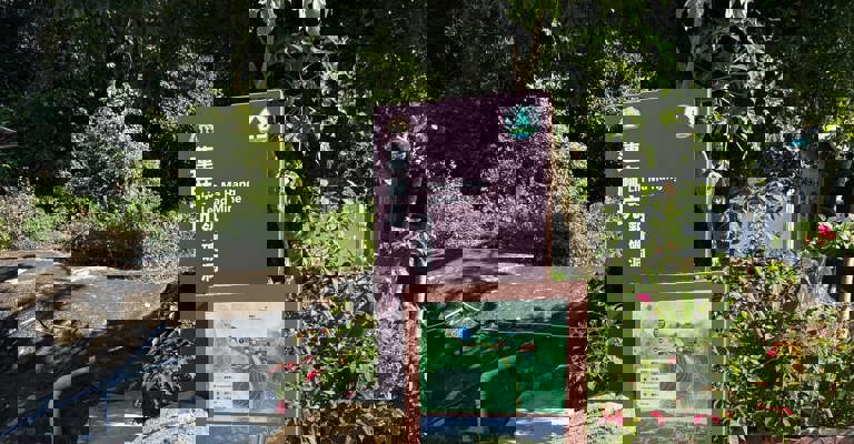 tall sign reading Lin Ma Hang Lead Mine in English and Cantonese