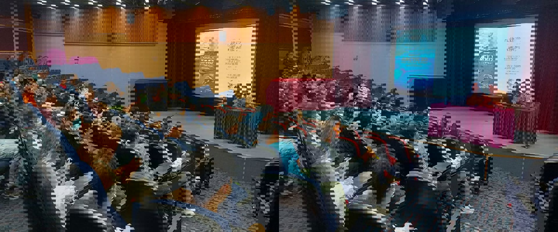 people sitting in a lecture theatre listening to a talk