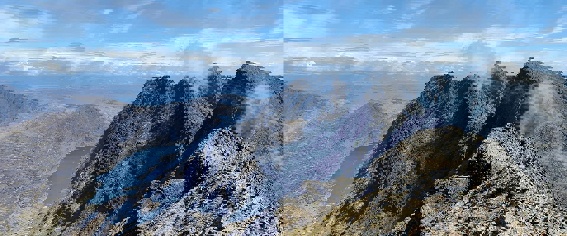 mountain range with a lake below