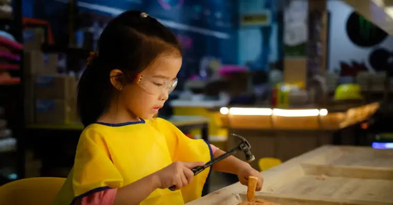 Child Examining Rock