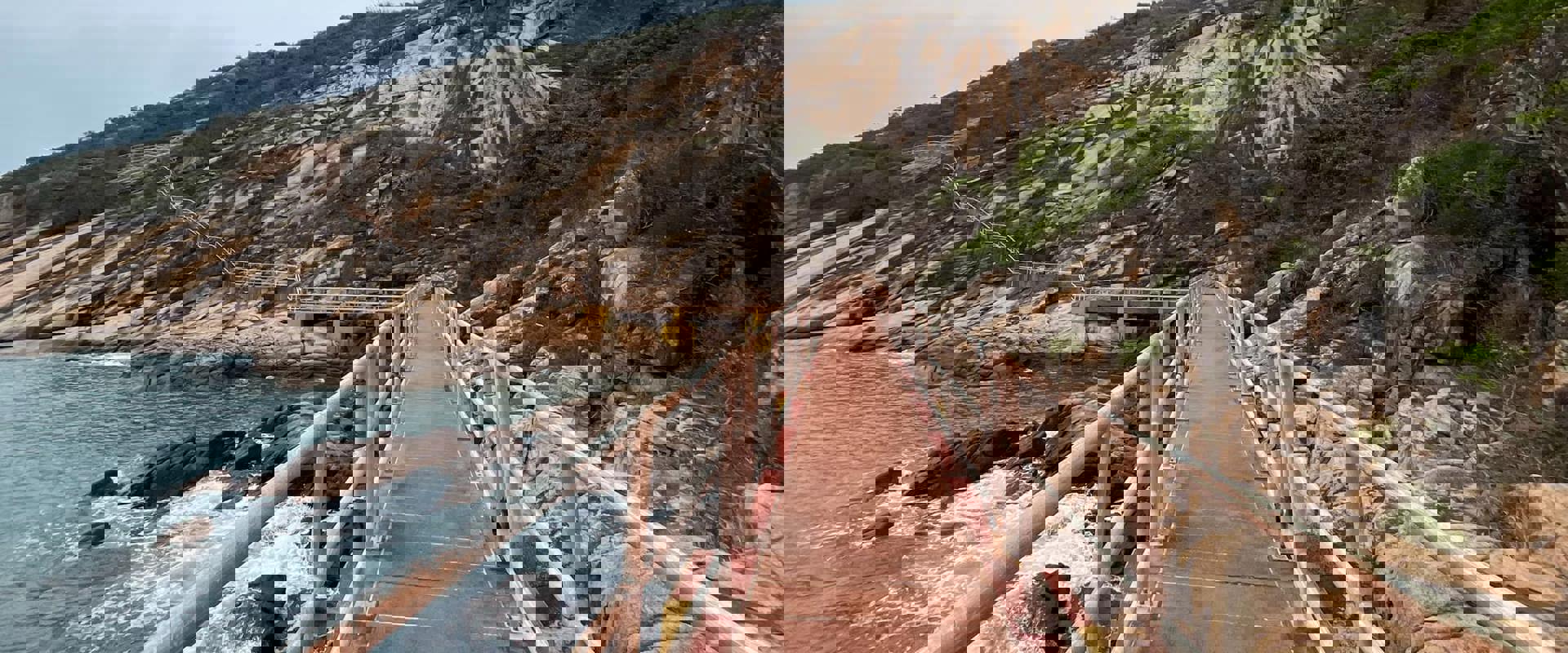 Trails walk and bridge along the rocky coastal line