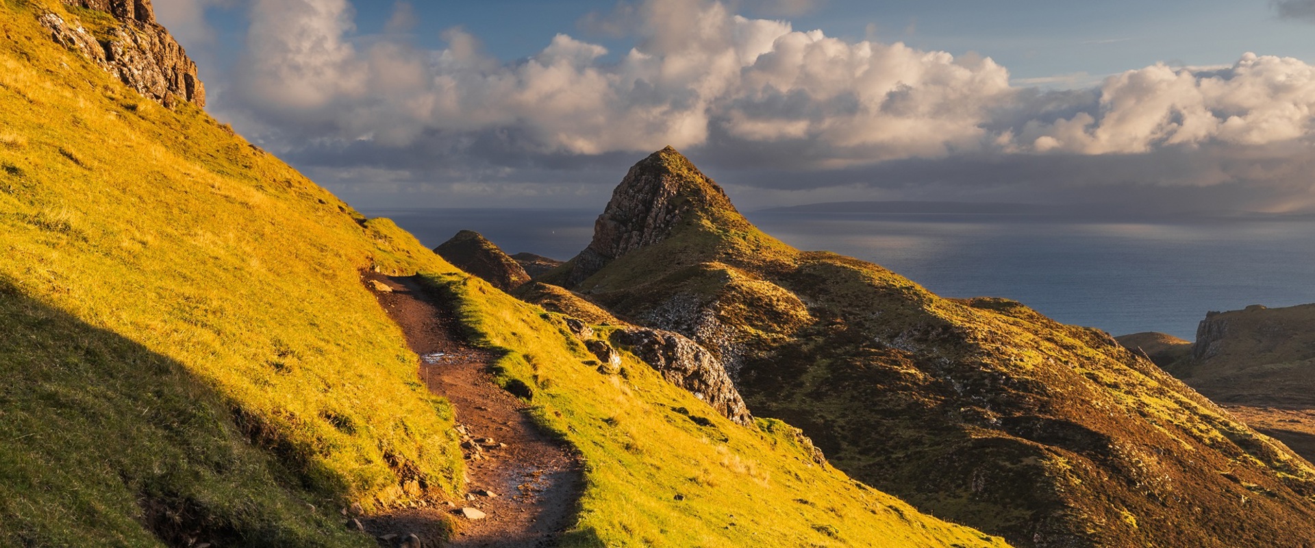 grass covered mountainous slopes and peaks