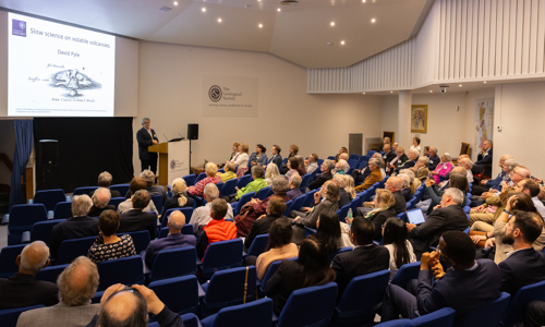 attendees seated in a lecture theatre listening to the speaker