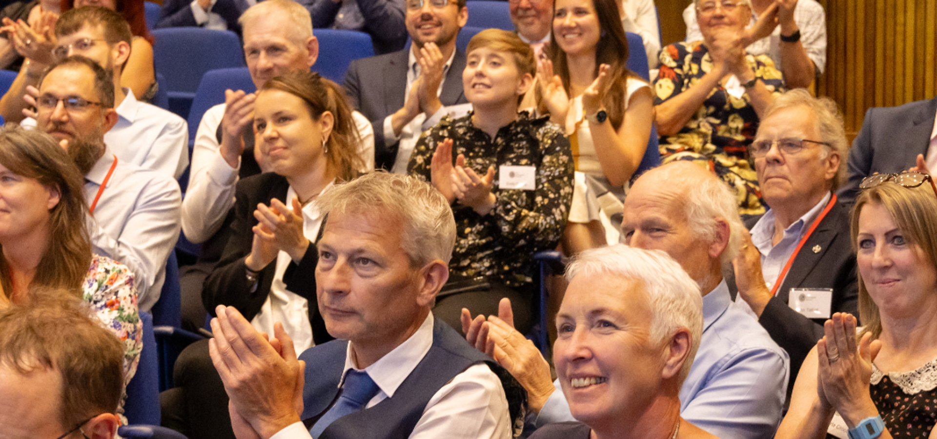 Members of the audience at a Geological Society Awards ceremony clapping