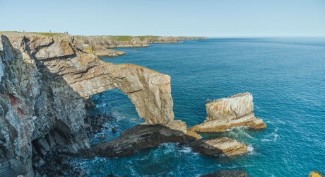 Natural limestone arch along the Pembroke coast in Wales, UK (Shutterstock)