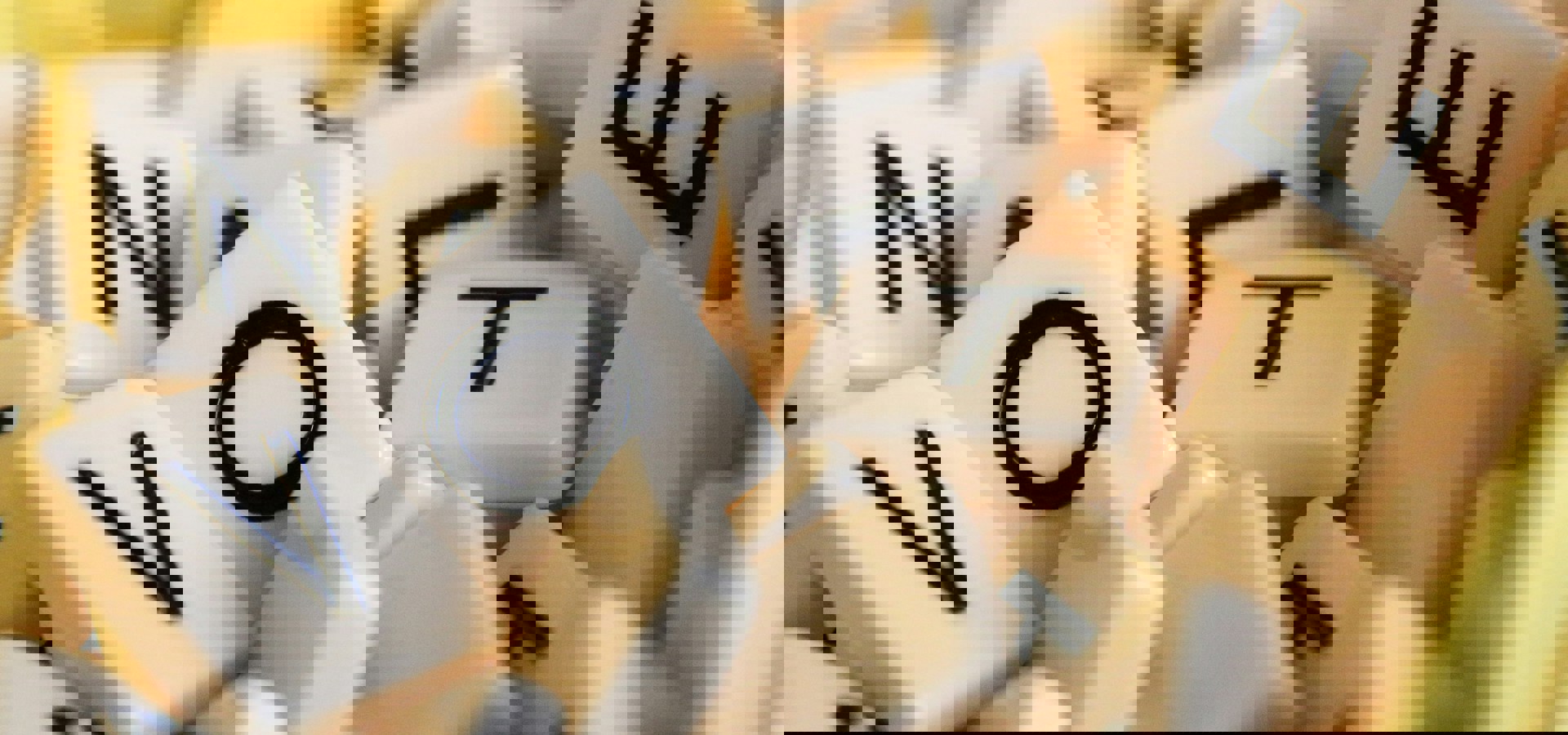 A pile of Scrabble tiles spelling out the word VOTE