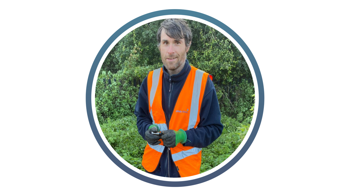 man with short grey hair wearing a high vis jacket and dark blue fleece as well as gloves