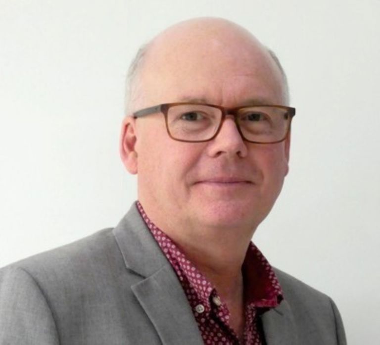 white man with glasses and a suit and tie