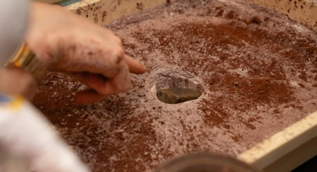 box of sand with a whole in the middle