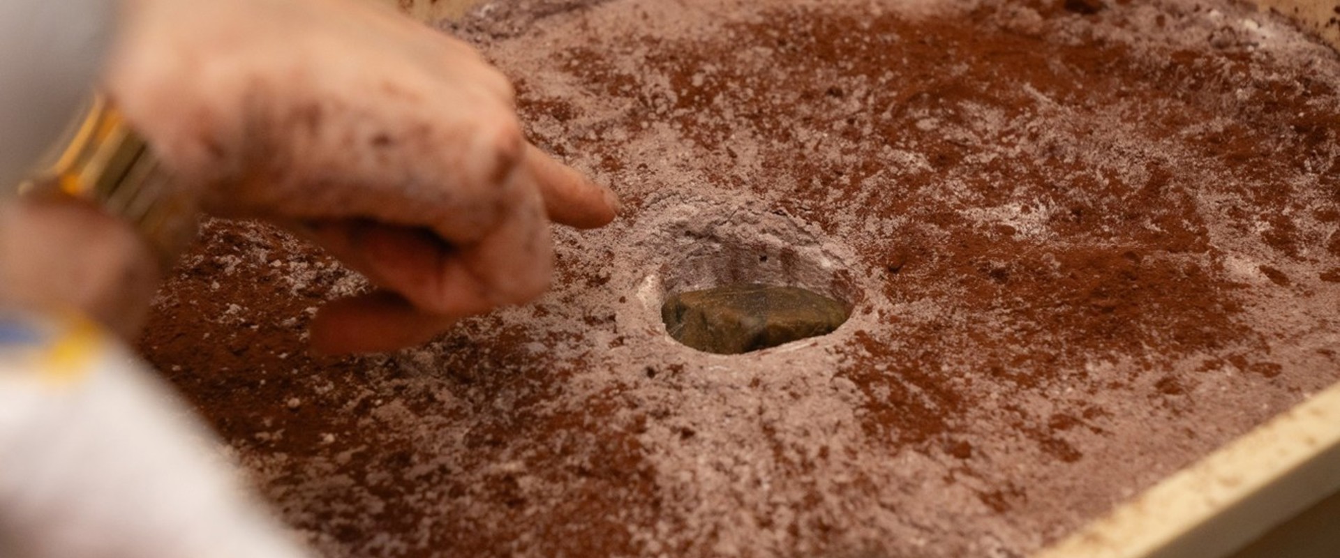 box of sand with a whole in the middle