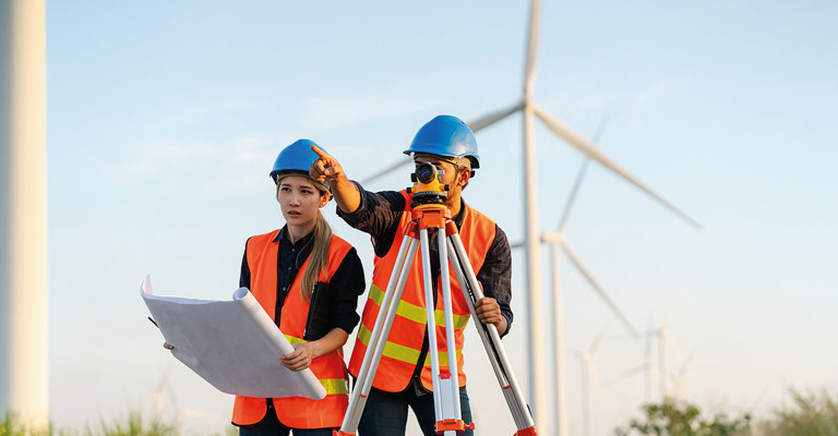 a man and woman in hard hats and high vis jackets