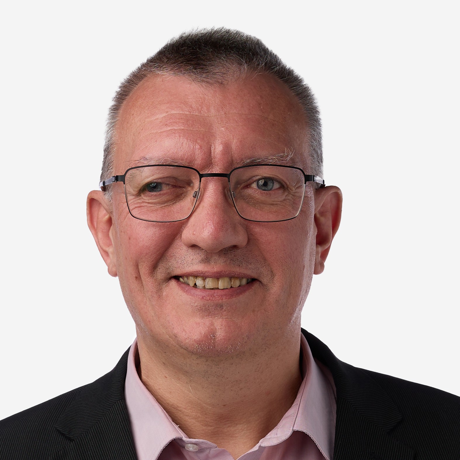 white man with glasses wearing a pink shirt and grey jacket
