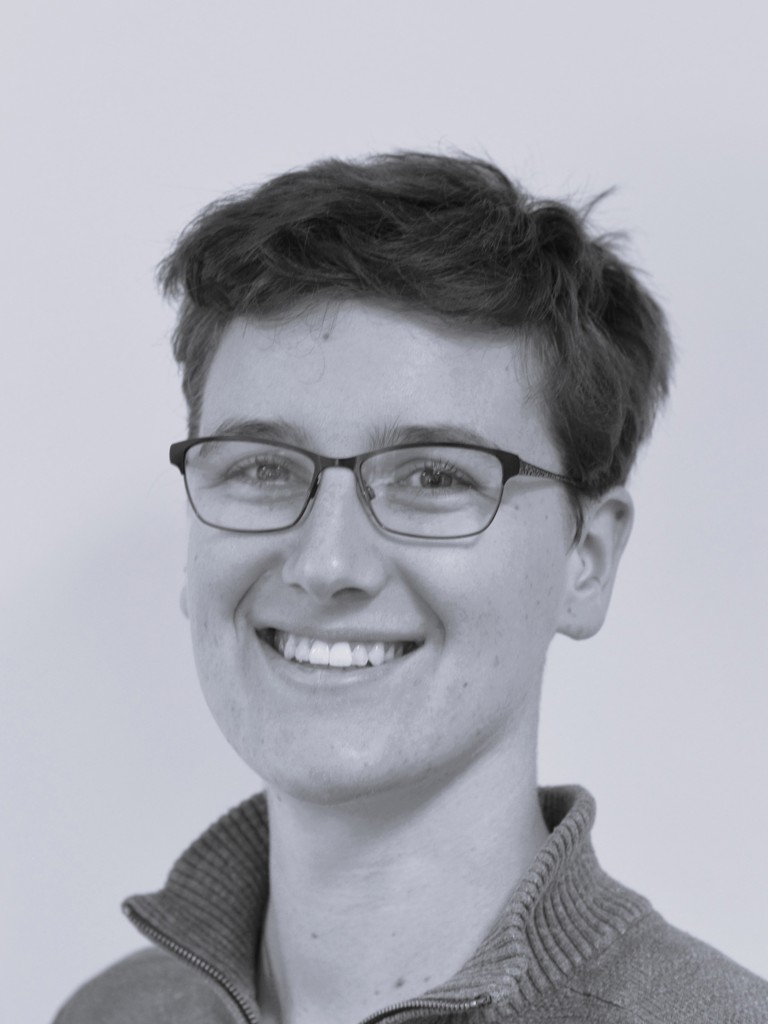 woman with short dark hair and glasses