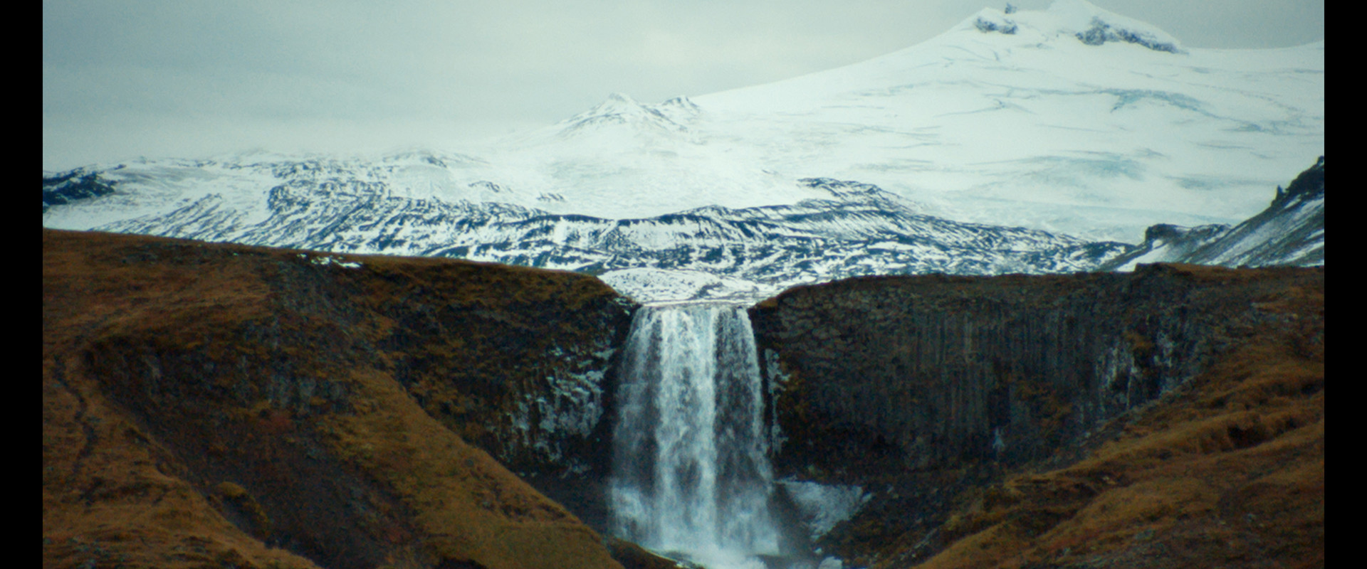 A glacial tongue behind a waterfall