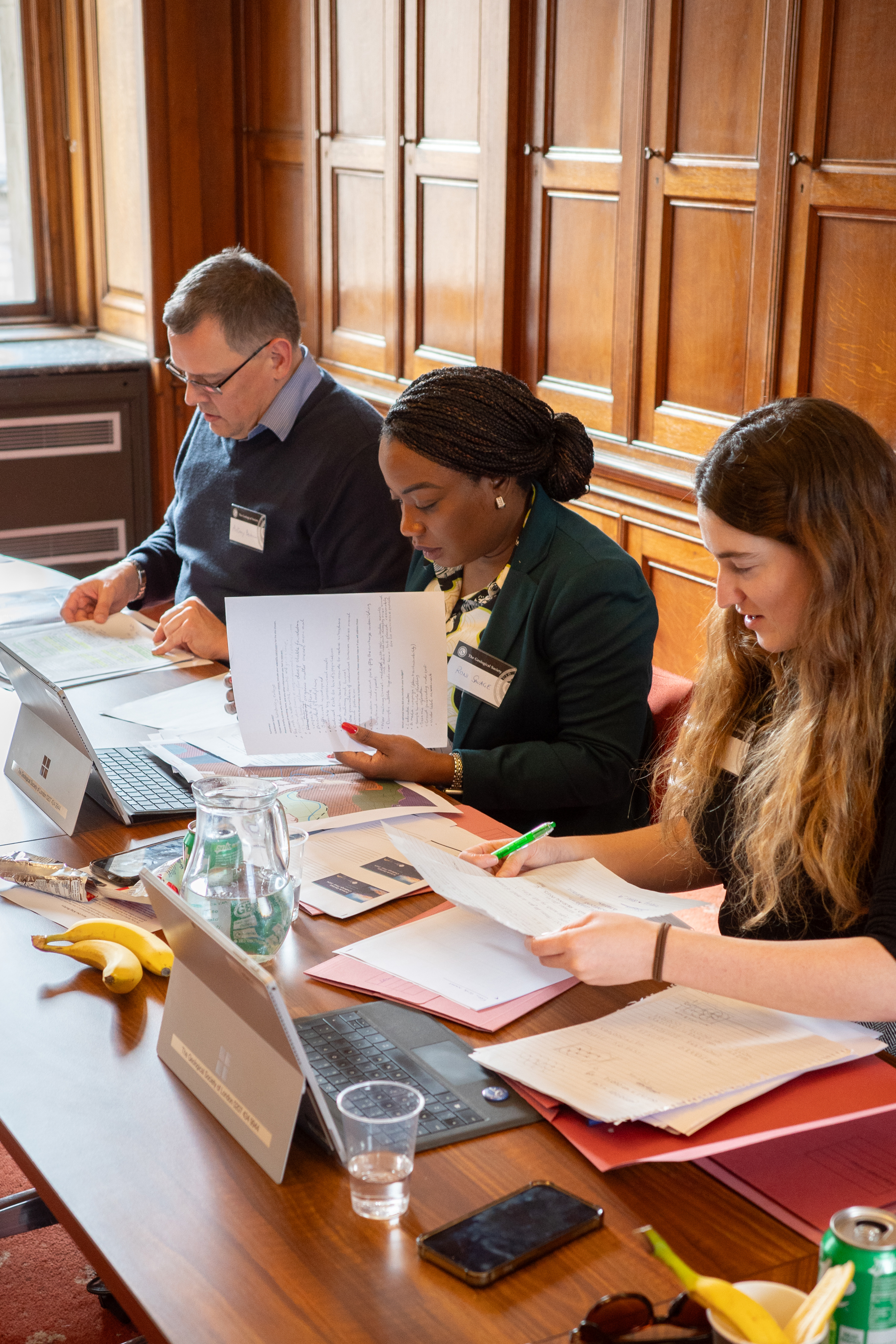 Three judges evaluates secondary students' work on a geology challenge