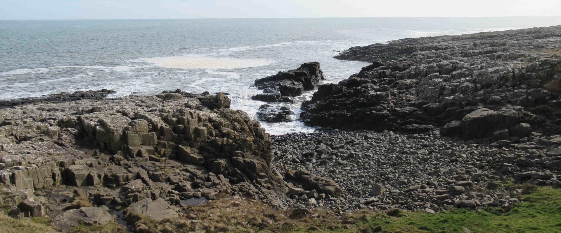 rocks sloping out to sea